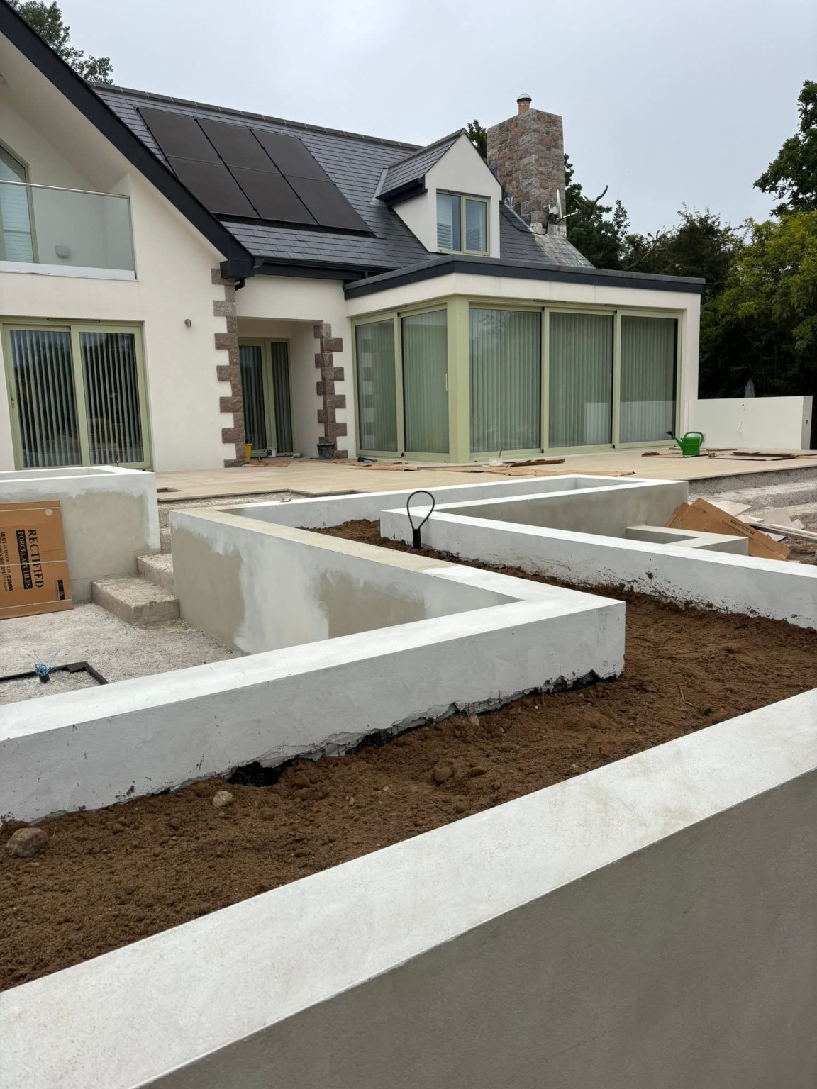 Rendered raised planter beds with stone-edged paths