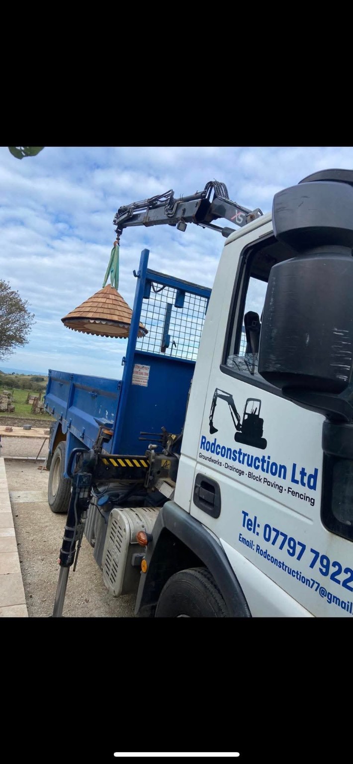 Rod Construction Ltd branded tipper truck with lifting crane